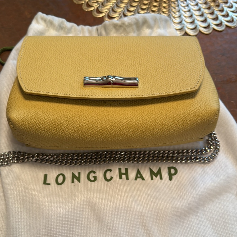 Longchamp Pale Yellow Clutch - a neutral color that  goes with everything